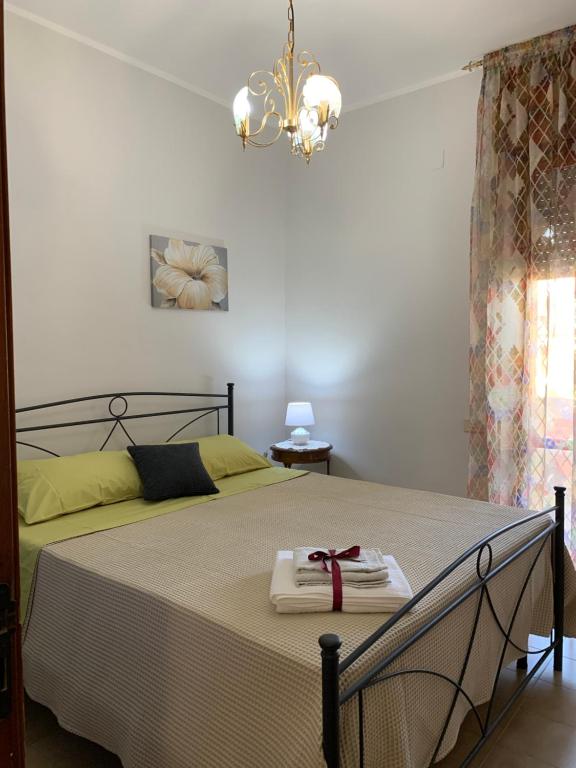 Posteľ alebo postele v izbe v ubytovaní a casa di barbara