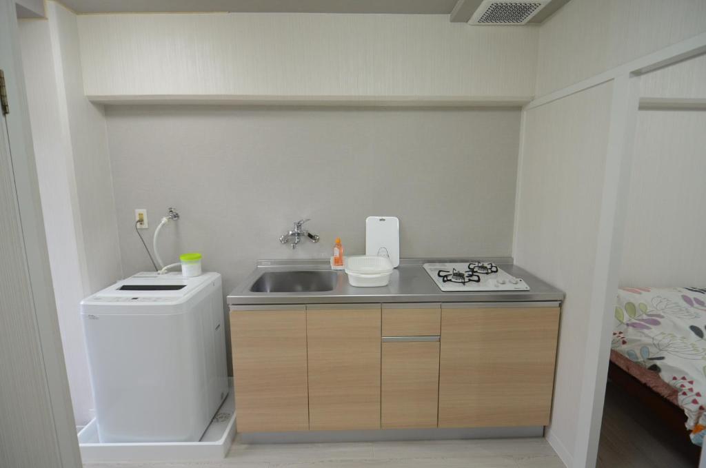 Comfort CUBE PHOENIX MIYAZAKIにあるキッチンまたは簡易キッチン