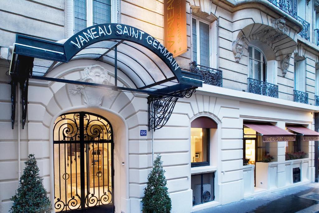 a building with a sign on the front of it at Hôtel Vaneau Saint Germain in Paris