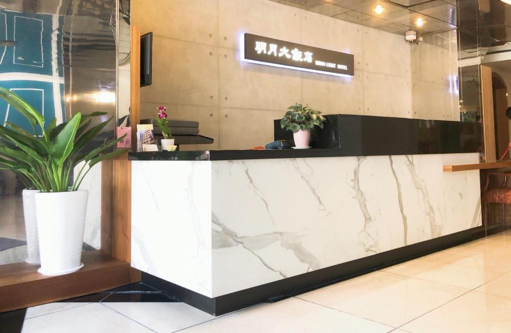 a lobby of a restaurant with a marble counter at Moonlight Hotel in Hsinchu City