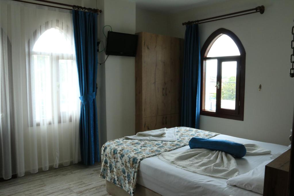 Postel nebo postele na pokoji v ubytování Eroglu City Hotel