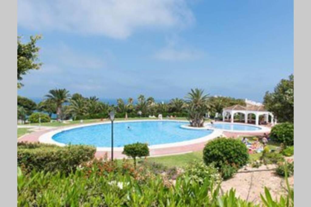 a large swimming pool in the middle of a park at GRAN VISTA in Santa Pola