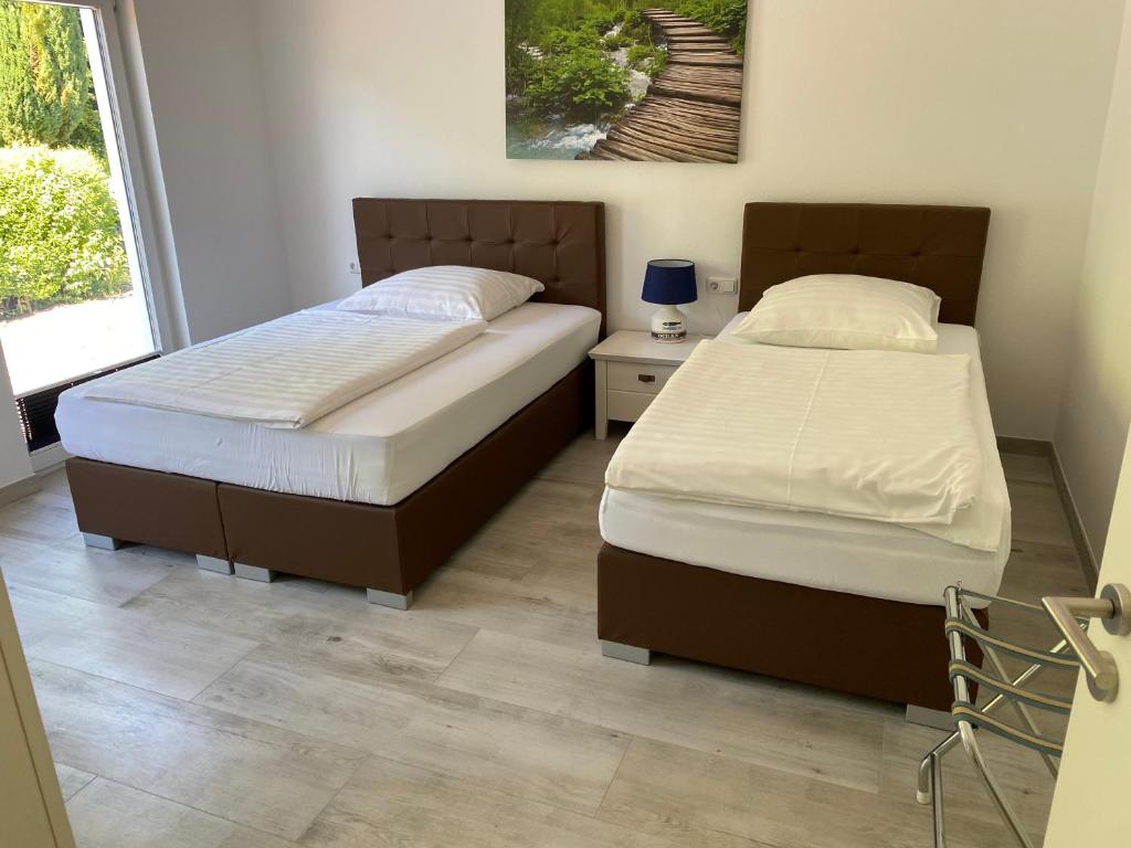 Postel nebo postele na pokoji v ubytování Gästehaus Schewe