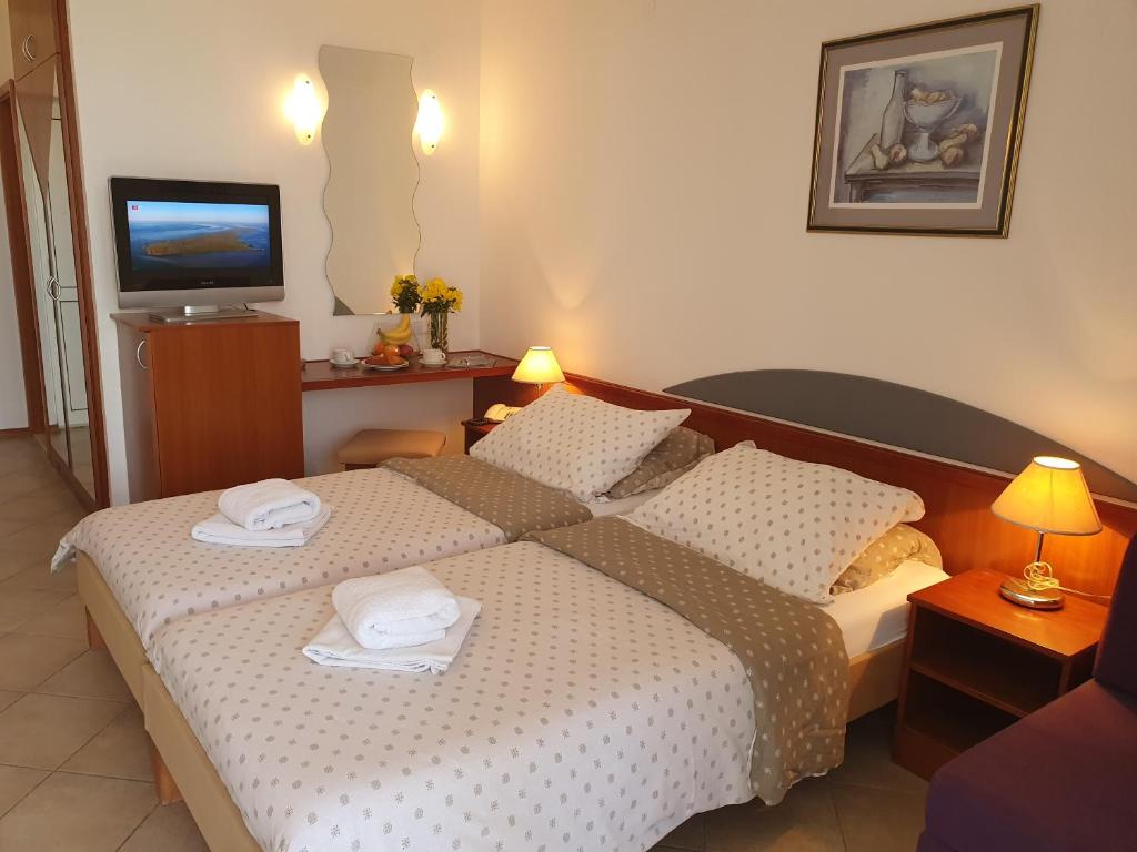 Postel nebo postele na pokoji v ubytování Tourist Settlement Brzet