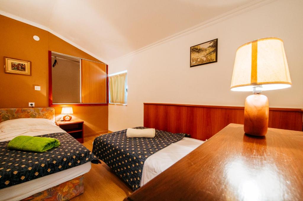 Posteľ alebo postele v izbe v ubytovaní Olive House Zadar