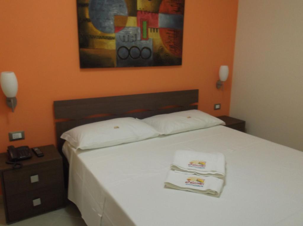 Łóżko lub łóżka w pokoju w obiekcie Suliccenti b&b Marzamemi