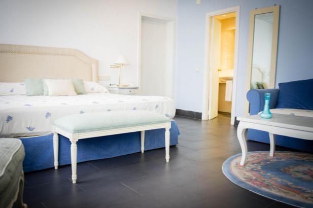 Postel nebo postele na pokoji v ubytování Hotel Prado Real