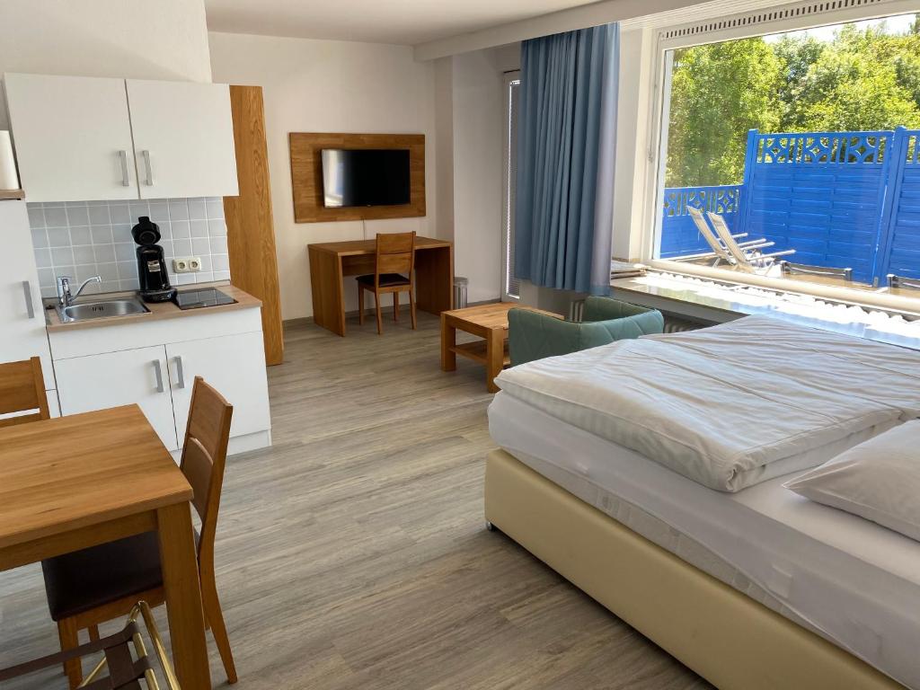Postel nebo postele na pokoji v ubytování Gästehaus Schewe