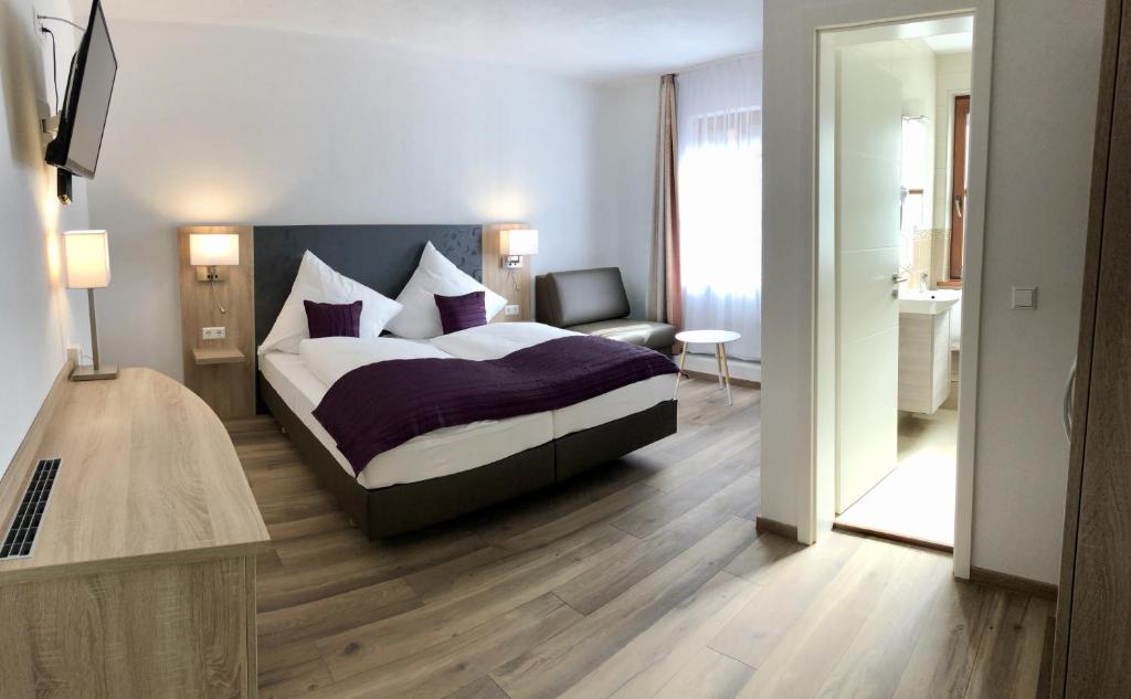 Postel nebo postele na pokoji v ubytování A Lotus Hotel