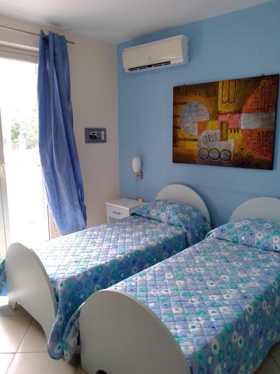 Łóżko lub łóżka w pokoju w obiekcie Suliccenti b&b Marzamemi