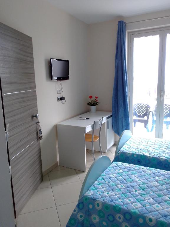 Łóżko lub łóżka w pokoju w obiekcie Suliccenti b&b Marzamemi