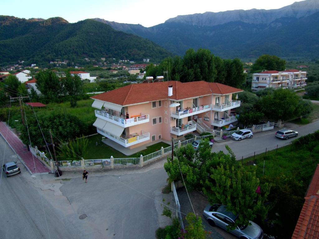 an overhead view of a building with a parking lot at Porto Thassos Apartments & Studios in Skala Potamias