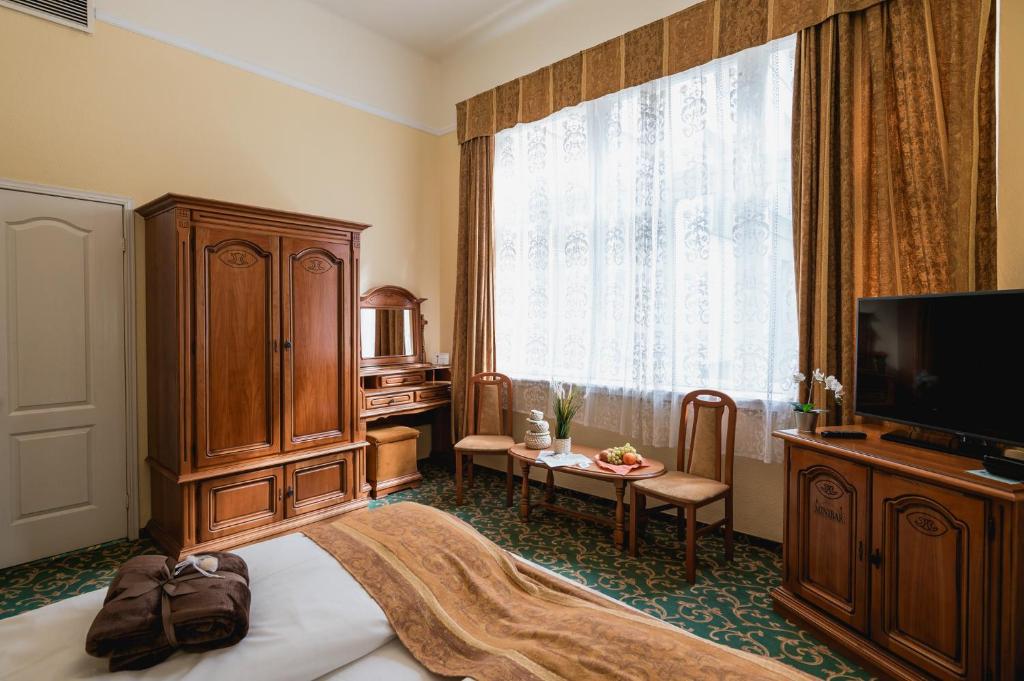 TV a/nebo společenská místnost v ubytování City Hotel UNIO superior