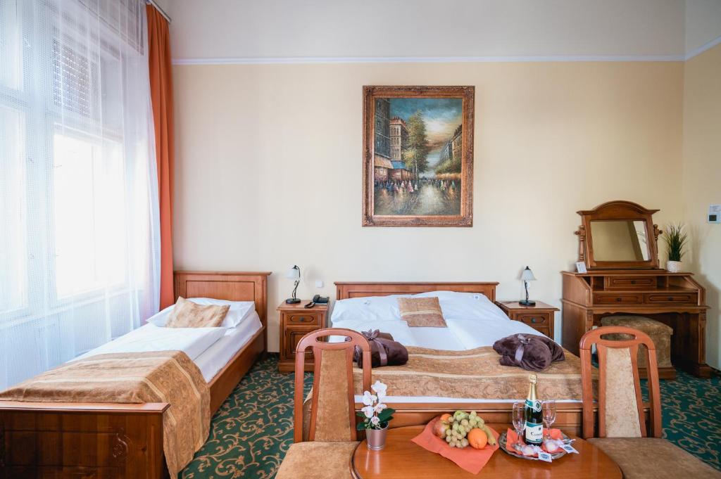 Postel nebo postele na pokoji v ubytování City Hotel UNIO superior