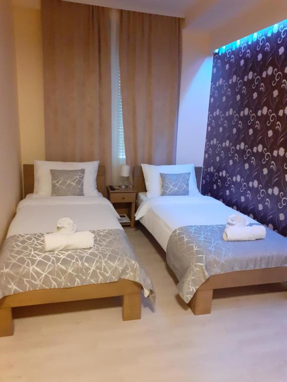 Postel nebo postele na pokoji v ubytování Apartmani CENTAR- Smederevo