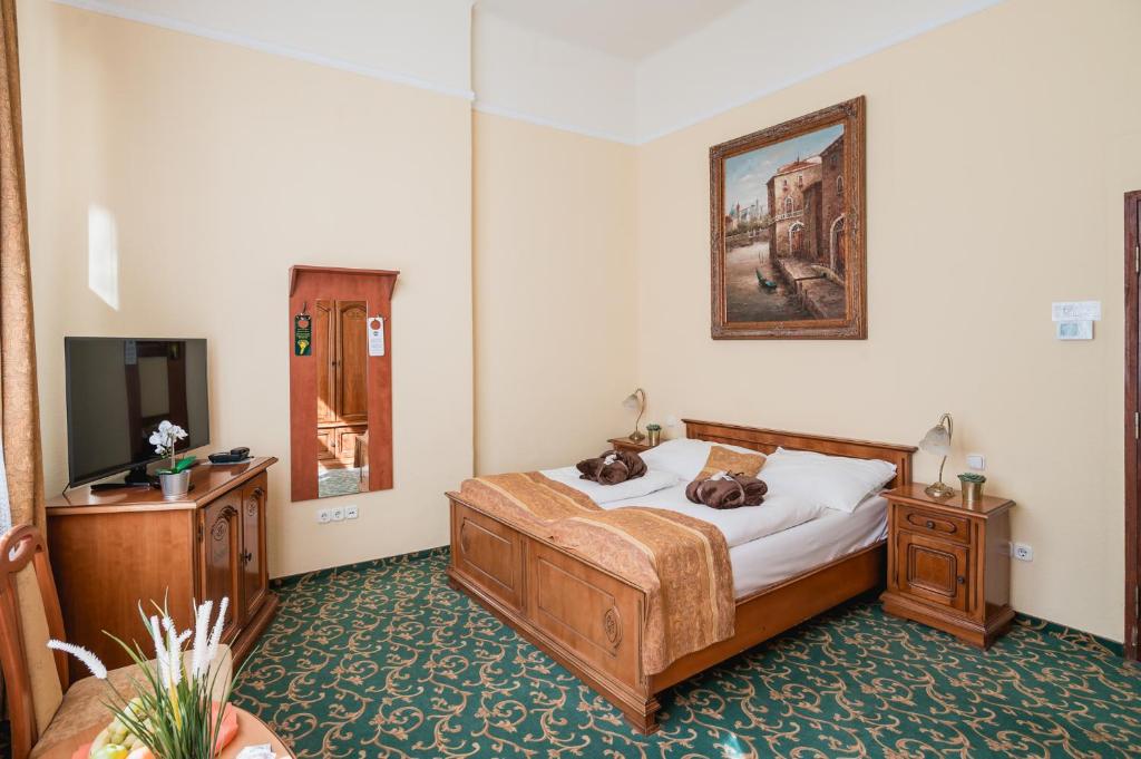 Postel nebo postele na pokoji v ubytování City Hotel UNIO superior