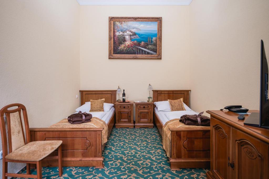Postel nebo postele na pokoji v ubytování City Hotel UNIO superior