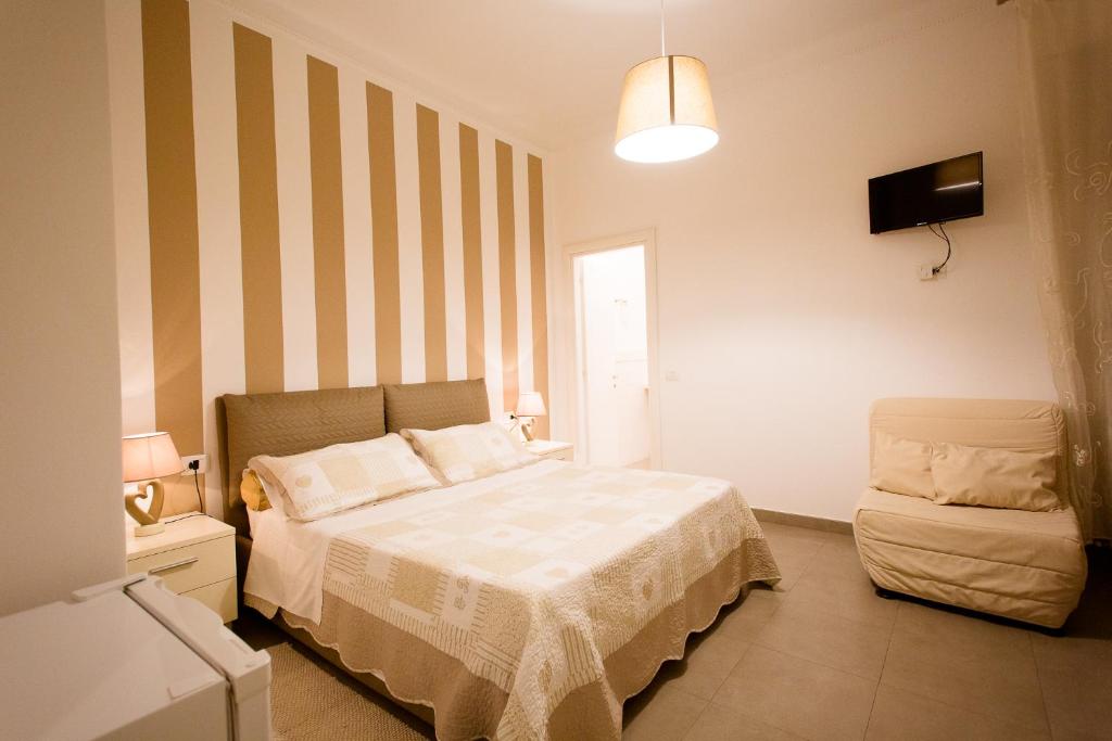 Postel nebo postele na pokoji v ubytování Affittacamere e appartamenti - Rent rooms and Apartments Le Camere Nel Corso - ADULTS ONLY