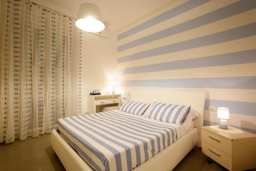 Postel nebo postele na pokoji v ubytování Affittacamere e appartamenti - Rent rooms and Apartments Le Camere Nel Corso - ADULTS ONLY