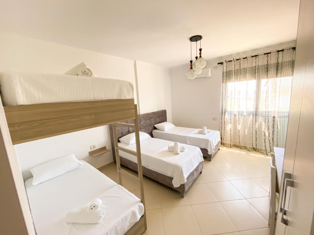 Postel nebo postele na pokoji v ubytování Hotel Abedini