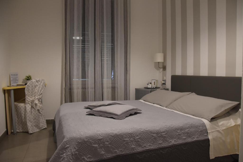 Postel nebo postele na pokoji v ubytování Affittacamere e appartamenti - Rent rooms and Apartments Le Camere Nel Corso - ADULTS ONLY