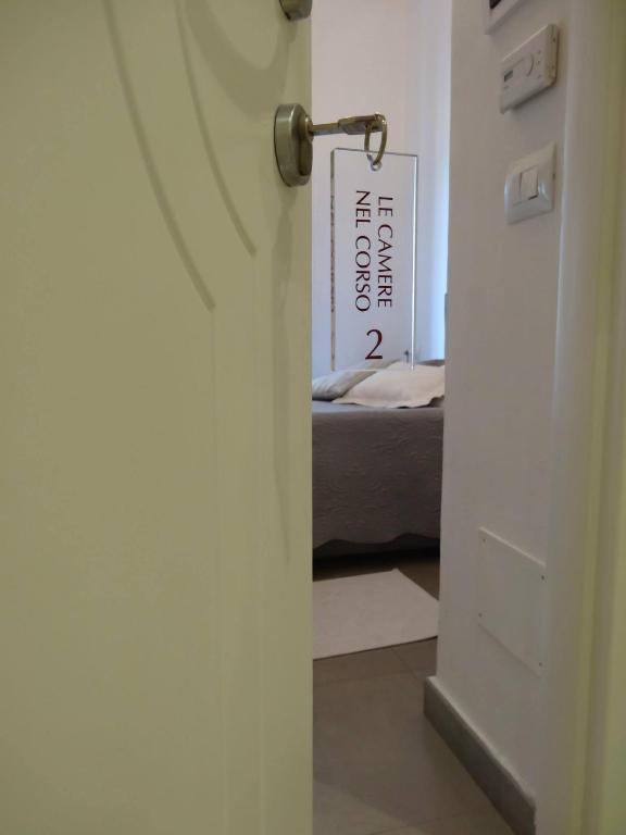 Postel nebo postele na pokoji v ubytování Affittacamere e appartamenti - Rent rooms and Apartments Le Camere Nel Corso - ADULTS ONLY
