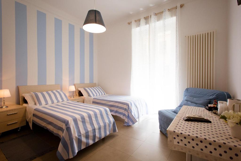 Postel nebo postele na pokoji v ubytování Affittacamere e appartamenti - Rent rooms and Apartments Le Camere Nel Corso - ADULTS ONLY
