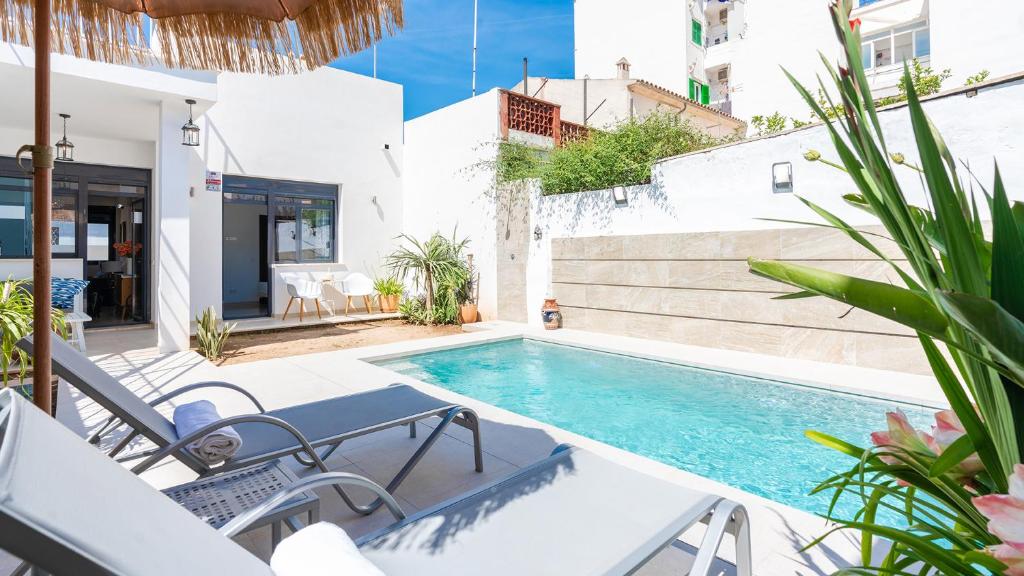 a swimming pool in the middle of a house at Casa en Son Espanyolet in Palma de Mallorca