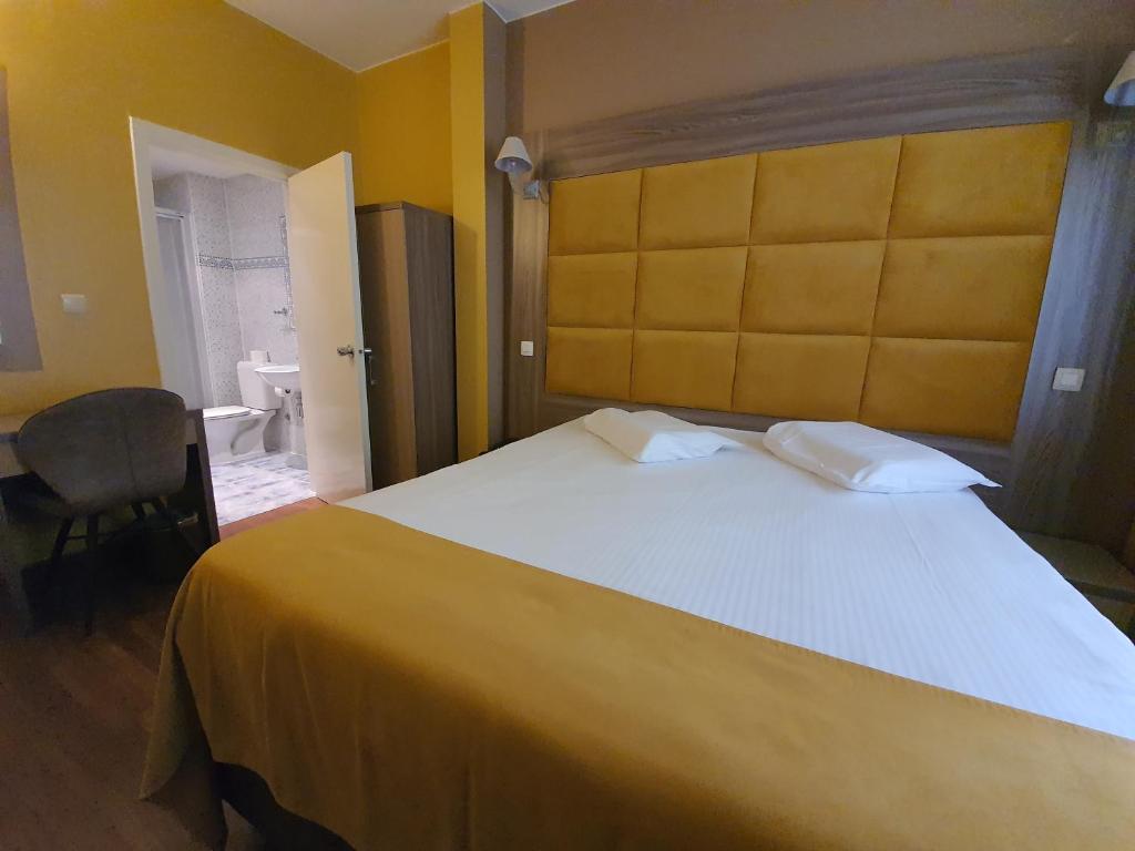 Postel nebo postele na pokoji v ubytování Hotel Midi-Zuid
