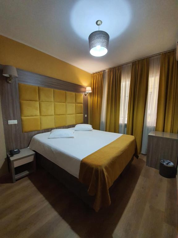 Postel nebo postele na pokoji v ubytování Hotel Midi-Zuid