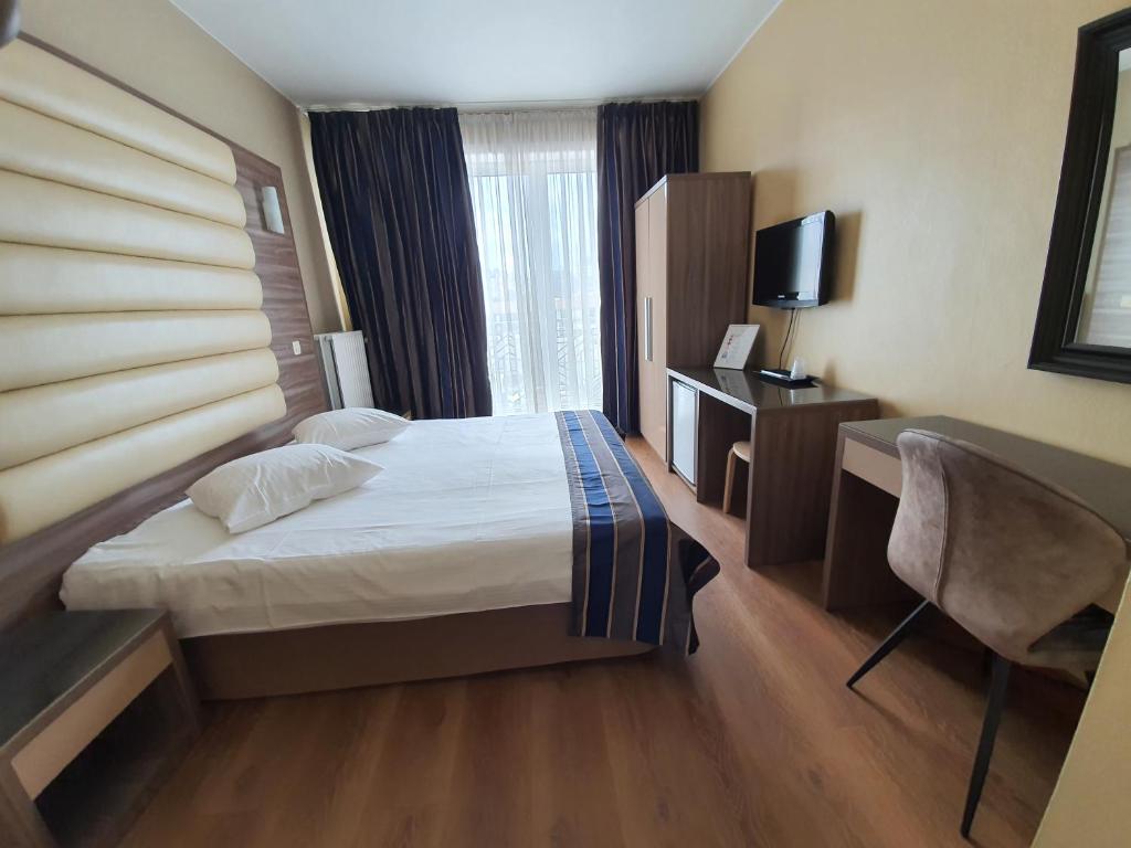 Postel nebo postele na pokoji v ubytování Hotel Midi-Zuid