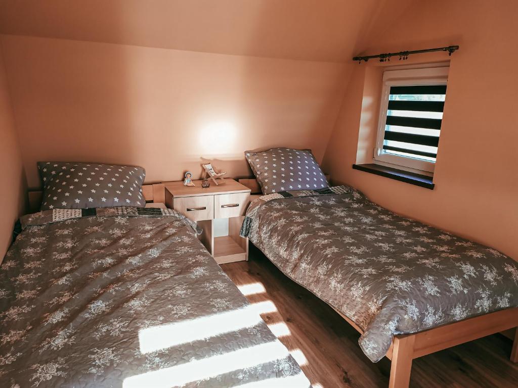 Postel nebo postele na pokoji v ubytování Domek u Mariusza