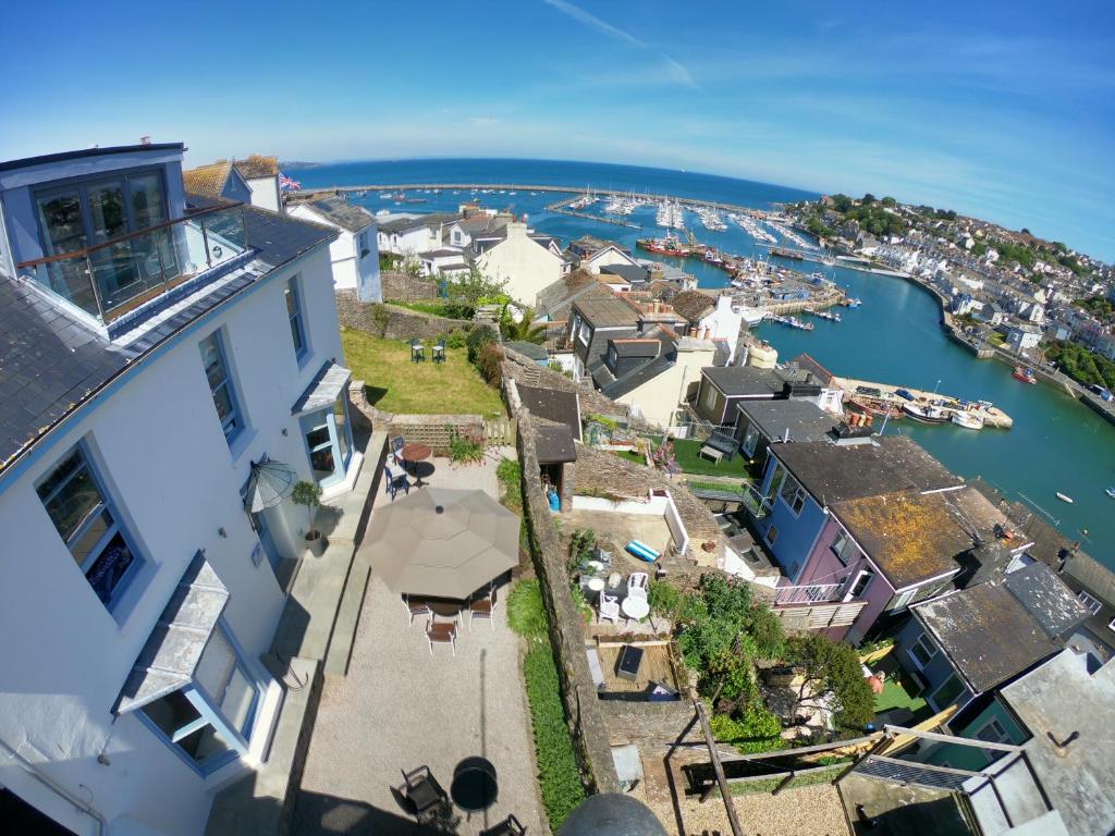 an aerial view of a house next to the water at Beacon House B&B Brixham in Brixham