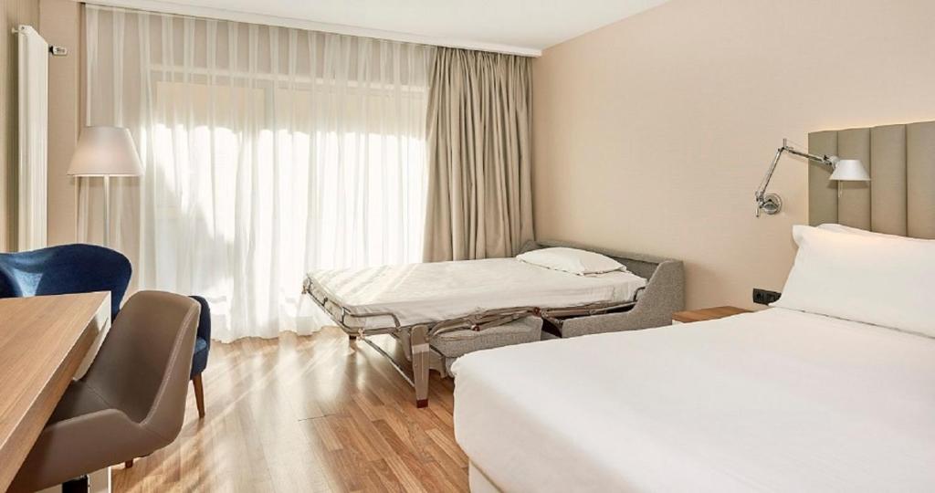 Postel nebo postele na pokoji v ubytování NH Andorra la Vella