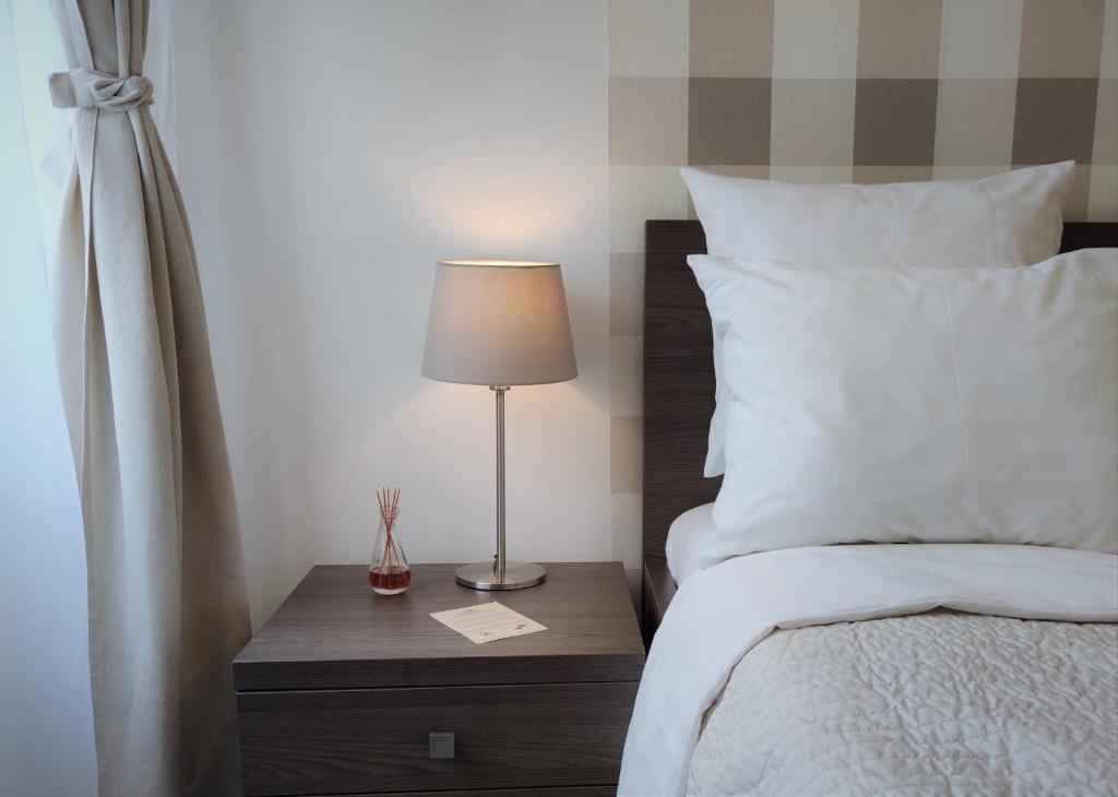 Postel nebo postele na pokoji v ubytování Hotel Residence Spalena