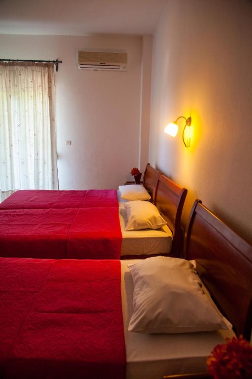 Voodi või voodid majutusasutuse Hotel Adonis toas