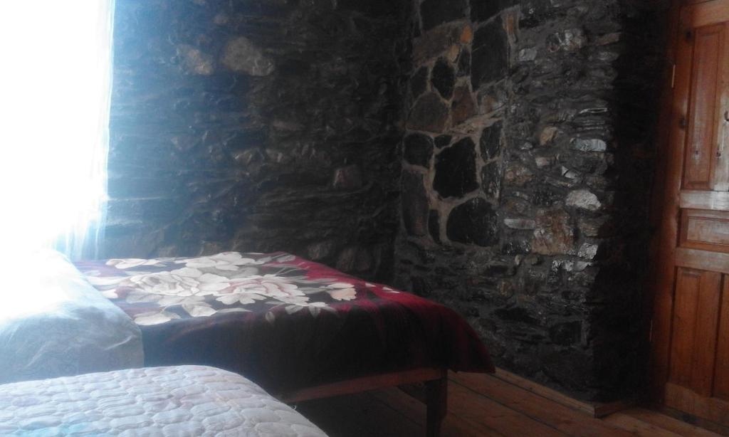 Postel nebo postele na pokoji v ubytování Stone House marexi