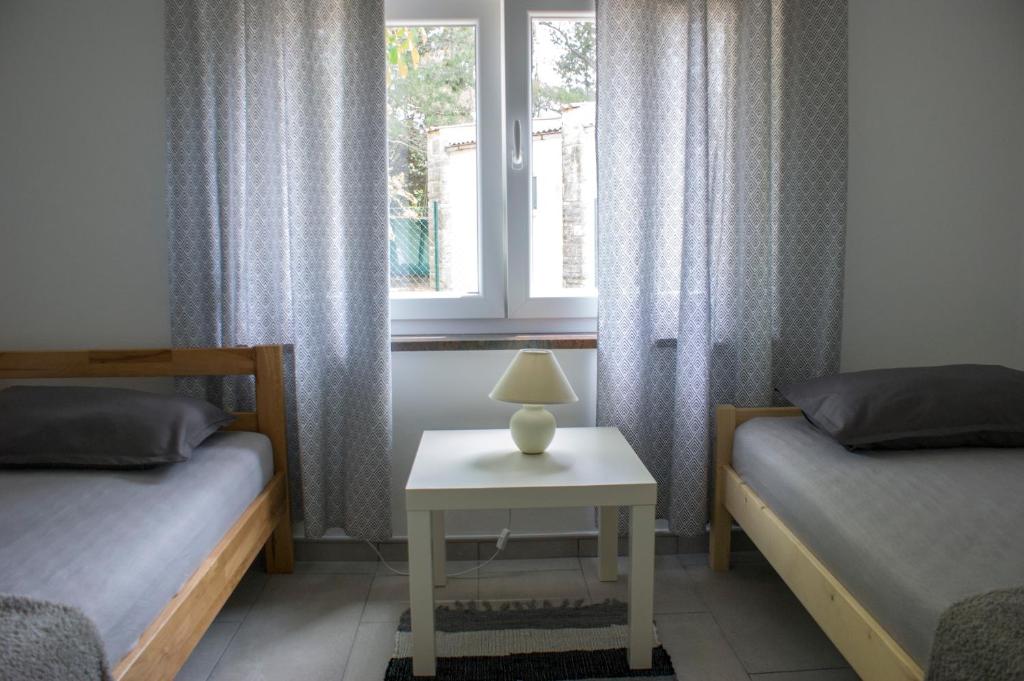 Łóżko lub łóżka w pokoju w obiekcie Holiday home I.D.A.