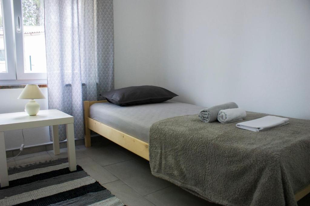 Łóżko lub łóżka w pokoju w obiekcie Holiday home I.D.A.