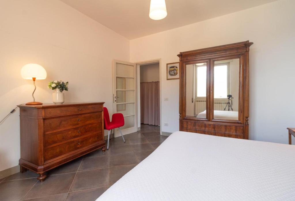 Łóżko lub łóżka w pokoju w obiekcie Mamma Ciccia Holiday Home - Confalonieri