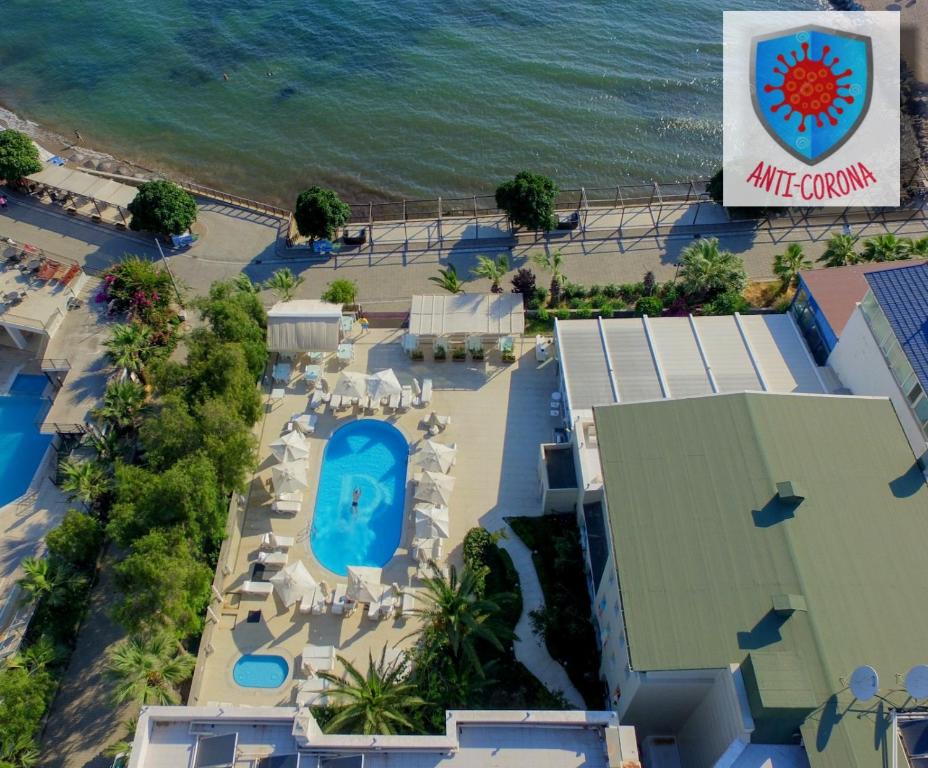an overhead view of a resort with a pool and the ocean at Dragut Point North Hotel - All Inclusive in Turgutreis