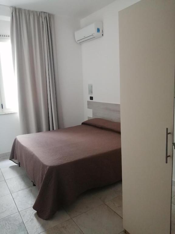 Postel nebo postele na pokoji v ubytování Hotel Brennero