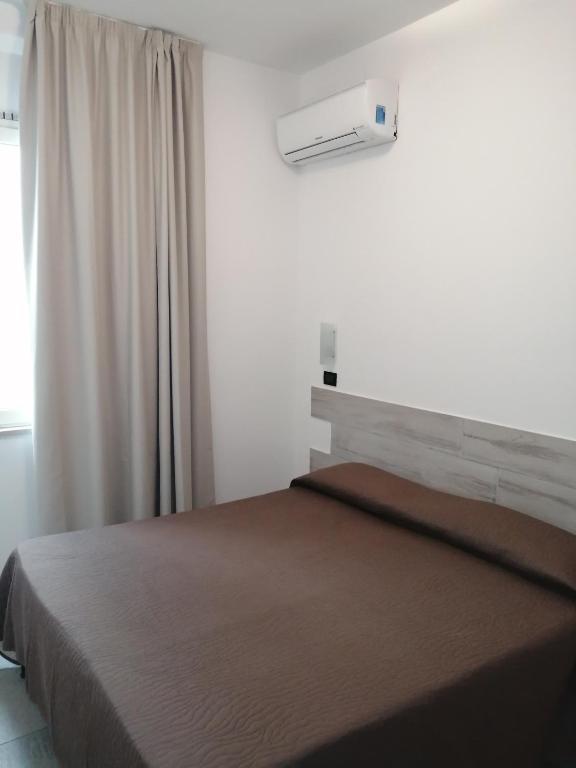 Postel nebo postele na pokoji v ubytování Hotel Brennero