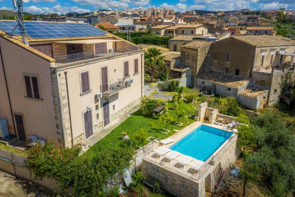 an aerial view of a house with a swimming pool at Villa Rosaria Rooms in Noto