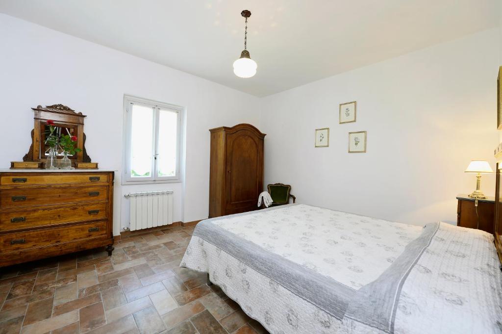 Postel nebo postele na pokoji v ubytování Casa Vacanze Podere Ugolini