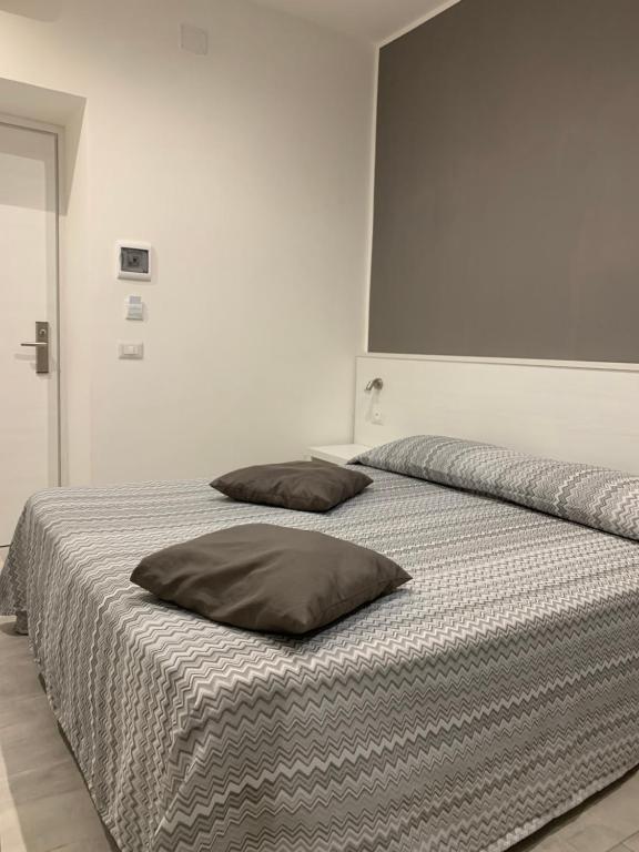Postel nebo postele na pokoji v ubytování Hotel Assarotti