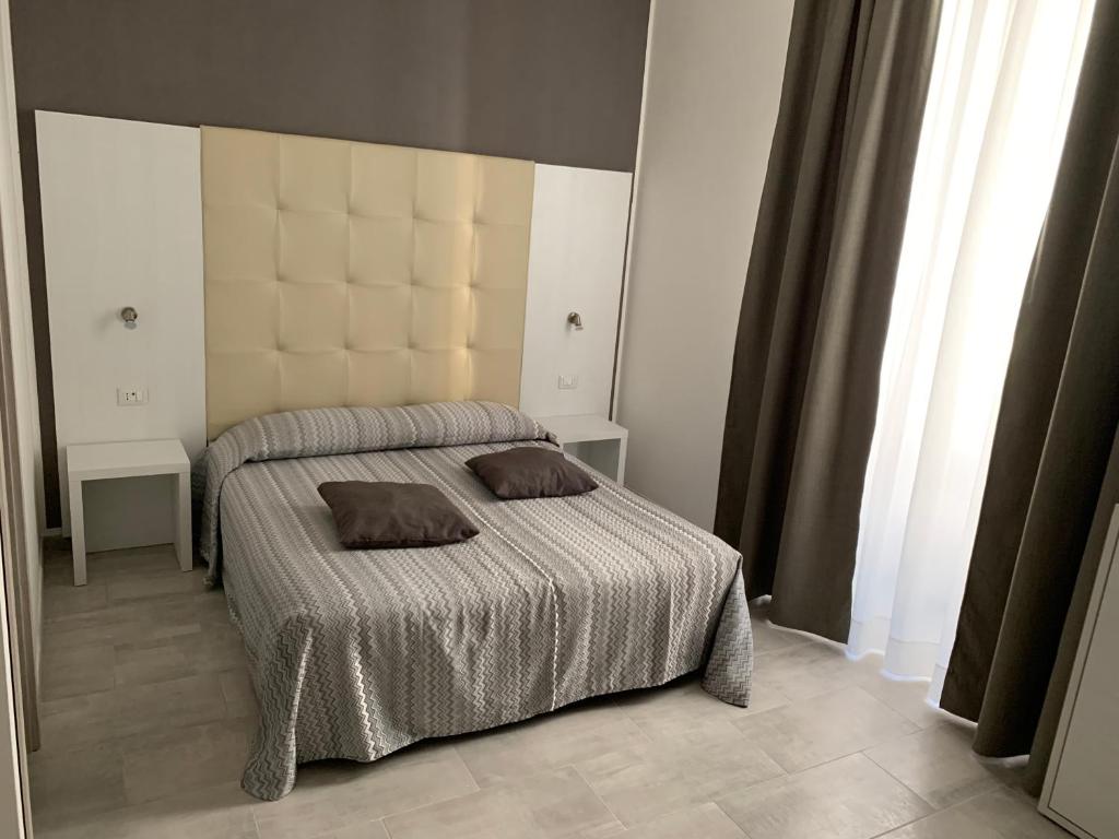 Postel nebo postele na pokoji v ubytování Hotel Assarotti