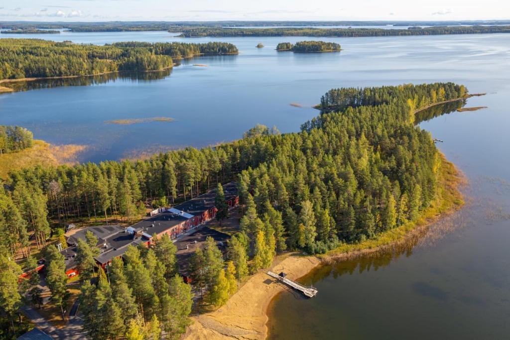 an aerial view of a lake with a train at Herttua Hotel and Spa in Kerimäki