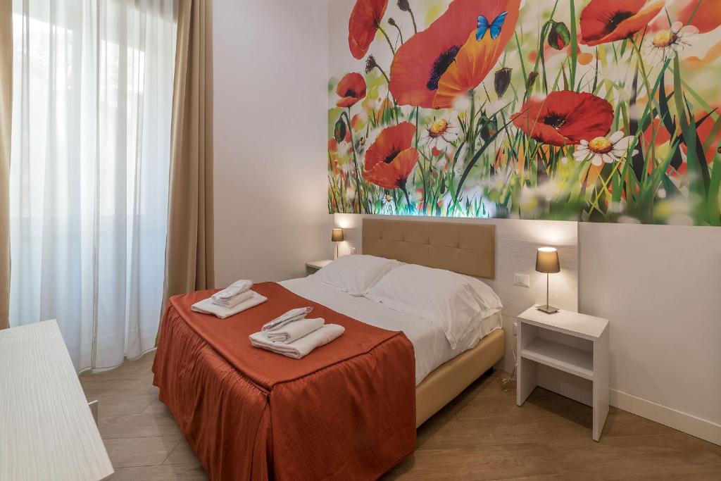 Postel nebo postele na pokoji v ubytování Hotel Mimosa Pantheon