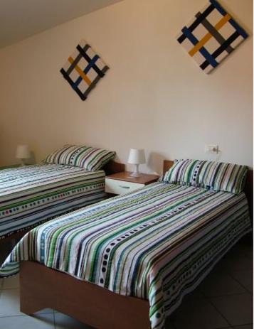 Posteľ alebo postele v izbe v ubytovaní B&B La Palma